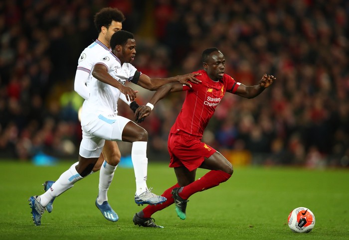 LIVERPOOL, ENGLAND - FEBRUARY 24: Sadio Mané of Liverpool looks to break past Jeremy Ngakia of West Ham United during the Premier League match between Liverpool FC and West Ham United at Anfield on February 24, 2020 in Liverpool, United Kingdom. (Photo by Clive Brunskill/Getty Images)