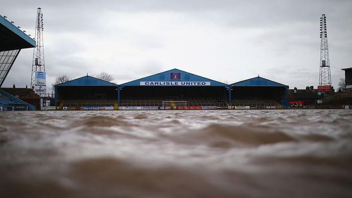 Carlisle United CARLISLE, UNITED KINGDOM - DECEMBER 09: The pitch at Carlisle Football Club is still partly submerged after flooding created by Storm Desmond on December 9, 2015 in Carlisle, United Kingdom. Contractors and utilities workers are now working towards getting people back in their homes as forecasters predict another 12 hours of rain, although the effects will not be as severe as last weekend. (Photo by Christopher Furlong/Getty Images)