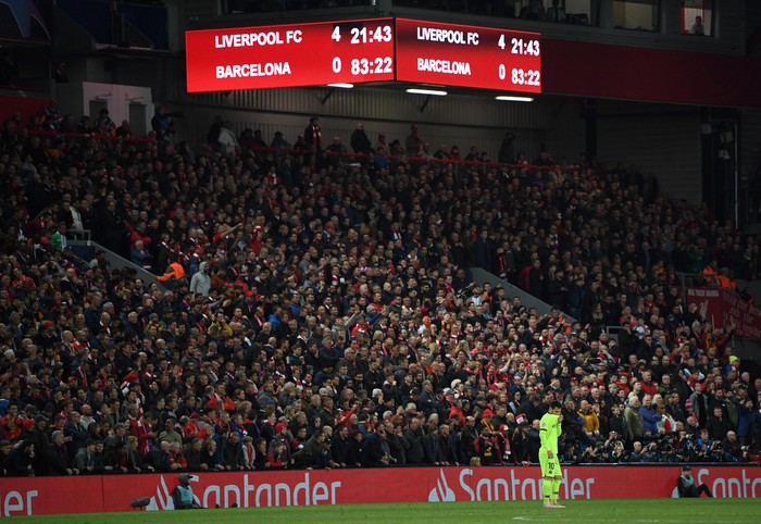 LIVERPOOL, ENGLAND - MAY 07:  Lionel Messi of Barcelona looks dejected as the scoreboard reads 4-0 during the UEFA Champions League Semi Final second leg match between Liverpool and Barcelona at Anfield on May 07, 2019 in Liverpool, England. (Photo by Shaun Botterill/Getty Images)