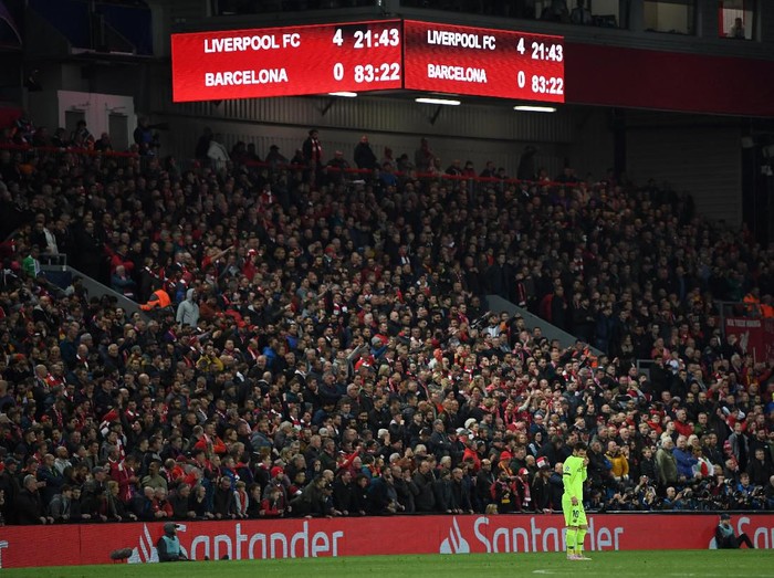 LIVERPOOL, ENGLAND - MAY 07:  Lionel Messi of Barcelona looks dejected as the scoreboard reads '4-0' during the UEFA Champions League Semi Final second leg match between Liverpool and Barcelona at Anfield on May 07, 2019 in Liverpool, England. (Photo by Shaun Botterill/Getty Images)