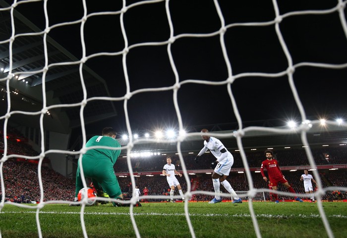 LIVERPOOL, ENGLAND - FEBRUARY 24: Mohamed Salah of Liverpool scores his sides second goal during the Premier League match between Liverpool FC and West Ham United at Anfield on February 24, 2020 in Liverpool, United Kingdom. (Photo by Clive Brunskill/Getty Images)