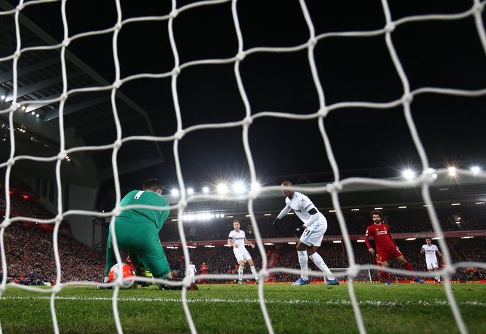 Liverpool vs West Ham LIVERPOOL, ENGLAND - FEBRUARY 24: Mohamed Salah of Liverpool scores his sides second goal during the Premier League match between Liverpool FC and West Ham United at Anfield on February 24, 2020 in Liverpool, United Kingdom. (Photo by Clive Brunskill/Getty Images)