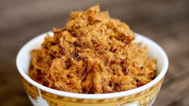 Rousong or beef floss on wood background.