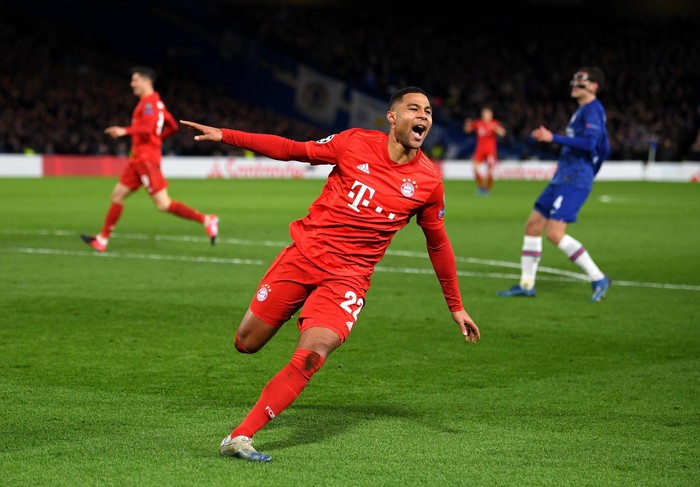 LONDON, ENGLAND - FEBRUARY 25: Serge Gnabry of Bayern Munich celebrates after scoring his teams second goal  during the UEFA Champions League round of 16 first leg match between Chelsea FC and FC Bayern Muenchen at Stamford Bridge on February 25, 2020 in London, United Kingdom. (Photo by Mike Hewitt/Getty Images)