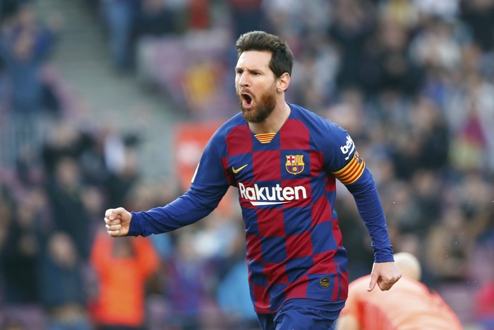 Barcelonas Lionel Messi celebrates after scoring his sides opening goal during a Spanish La Liga soccer match between Barcelona and Eibar at the Camp Nou stadium in Barcelona, Spain, Saturday Feb. 22, 2020. (AP Photo/Joan Monfort)