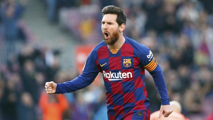 Barcelonas Lionel Messi celebrates after scoring his sides opening goal during a Spanish La Liga soccer match between Barcelona and Eibar at the Camp Nou stadium in Barcelona, Spain, Saturday Feb. 22, 2020. (AP Photo/Joan Monfort)