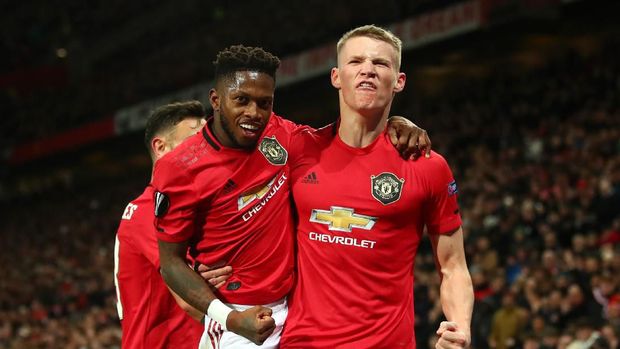 MANCHESTER, ENGLAND - FEBRUARY 27: Scott McTominay of Manchester United celebrates with teammate Fred of Manchester United after scoring his team's third goal during the UEFA Europa League round of 32 second leg match between Manchester United and Club Brugge at Old Trafford on February 27, 2020 in Manchester, United Kingdom. (Photo by Clive Brunskill/Getty Images)