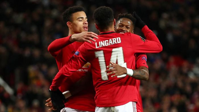 Man Utd vs Club Brugge MANCHESTER, ENGLAND - FEBRUARY 27: Fred of Manchester United celebrates with teammates Mason Greenwood and Jesse Lingard of Manchester United after scoring his teams fourth goal during the UEFA Europa League round of 32 second leg match between Manchester United and Club Brugge at Old Trafford on February 27, 2020 in Manchester, United Kingdom. (Photo by Clive Brunskill/Getty Images)