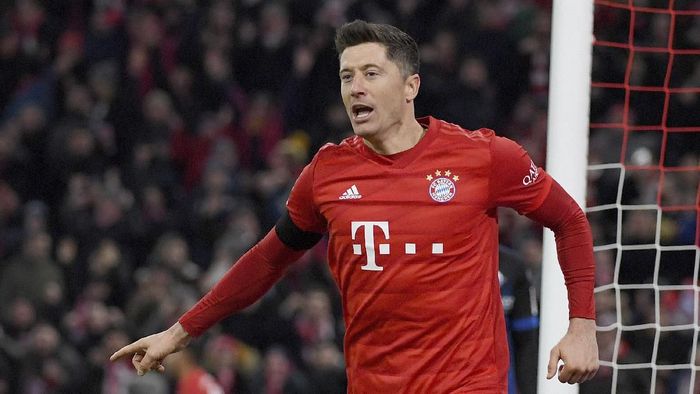 Robert Lewandowski Munichs Robert Lewandowski celebrates after scoring his side third goal during the German Bundesliga soccer match between Bayern Minich and SC Paderborn 07 in Munich, Germany, Friday, Feb. 21, 2020. ( Peter Kneffel/dpa via AP)
