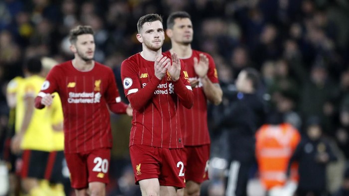 Liverpools Andrew Robertson, center, with teammates applaud to supporters at the end of the English Premier League soccer match between Watford and Liverpool at Vicarage Road stadium, in Watford, England, Saturday, Feb. 29, 2020. The match finished 3-0. (AP Photo/Alastair Grant)