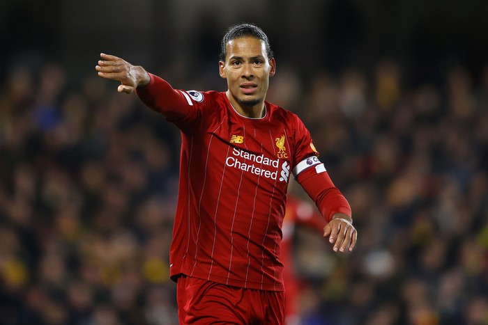 WATFORD, ENGLAND - FEBRUARY 29: Virgil van Dijk of Liverpool signals to a team mate during the Premier League match between Watford FC and Liverpool FC at Vicarage Road on February 29, 2020 in Watford, United Kingdom. (Photo by Richard Heathcote/Getty Images)