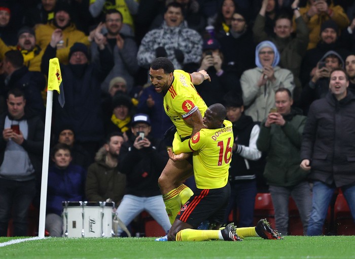WATFORD, ENGLAND - FEBRUARY 29: Troy Deeney of Watford celebrates after scoring his teams third goal with teammate Abdoulaye Doucoure during the Premier League match between Watford FC and Liverpool FC at Vicarage Road on February 29, 2020 in Watford, United Kingdom. (Photo by Richard Heathcote/Getty Images)