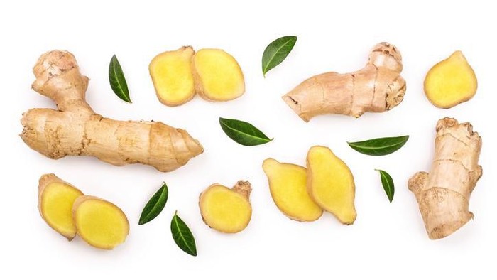 fresh Ginger root and slice isolated on white background with copy space for your text. Top view. Flat lay.