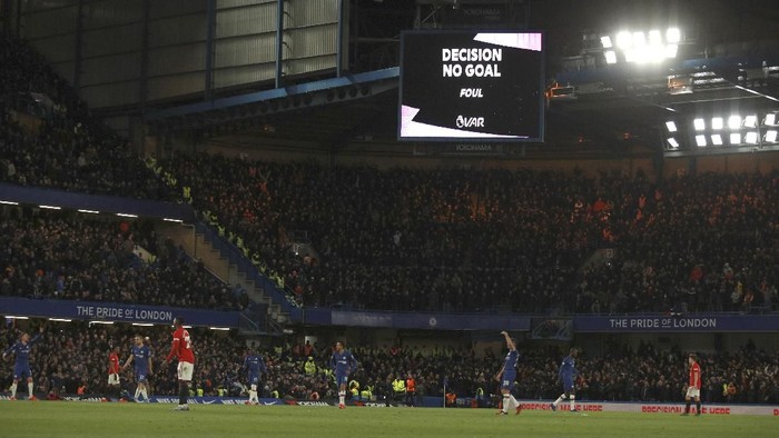 Players react as a goal by Chelseas Kurt Zouma is overturned by VAR during the English Premier League soccer match between Chelsea and Manchester United at Stamford Bridge in London, England, Monday, Feb. 17, 2020. (AP Photo/Ian Walton)