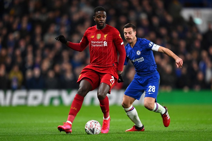 LONDON, ENGLAND - MARCH 03: Divock Origi of Liverpool is tackled by Cesar Azpilicueta of Chelsea during the FA Cup Fifth Round match between Chelsea FC and Liverpool FC at Stamford Bridge on March 03, 2020 in London, England. (Photo by Clive Mason/Getty Images)