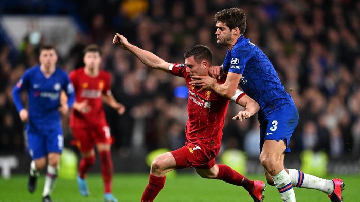 LONDON, ENGLAND - MARCH 03: James Milner of Liverpool is tackled by Marcos Alonso of Chelsea  during the FA Cup Fifth Round match between Chelsea FC and Liverpool FC at Stamford Bridge on March 03, 2020 in London, England. (Photo by Clive Mason/Getty Images)