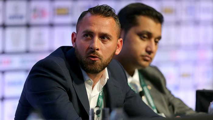 MANCHESTER, ENGLAND - SEPTEMBER 08: Footballer Michael Chopra of Kerala Blasters FC sits with Shirish Kulkarni, President of Liverpool International Football Academy DSK-Shivajians, right,  as they attend the Soccerex European Forum Conference Programme at Manchester Central on September 8, 2014 in Manchester, England.  (Photo by Dave Thompson/Getty Images)