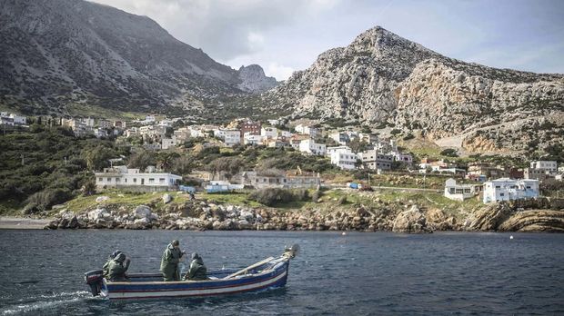 In this Wednesday, Feb. 12, 2020 photo, members of the first Moroccan female fishing cooperative go out to sea in a fishing boat, in the village of Belyounech on the coast of the Mediterranean, northern Morocco. Fisherwomen in Moroccan coastal villages are breaking through boundaries into the male-dominated world of fishing. The North African country's first female fishing cooperative, will after two years of training, hope to earn money from the fish for the first time. (AP Photo/Mosa'ab Elshamy)