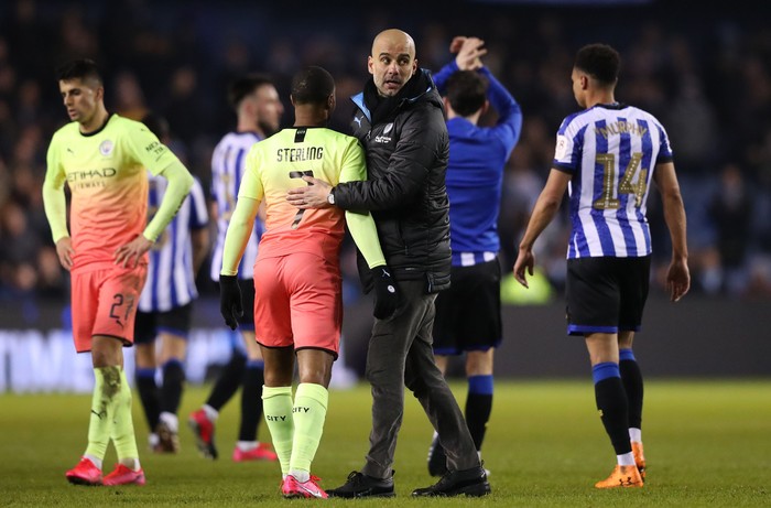 SHEFFIELD, ENGLAND - MARCH 04: Pep Guardiola, Manager of Manchester City celebrates with Raheem Sterling of Manchester City following their victory in the FA Cup Fifth Round match between Sheffield Wednesday and Manchester City at Hillsborough on March 04, 2020 in Sheffield, England. (Photo by Alex Livesey/Getty Images)