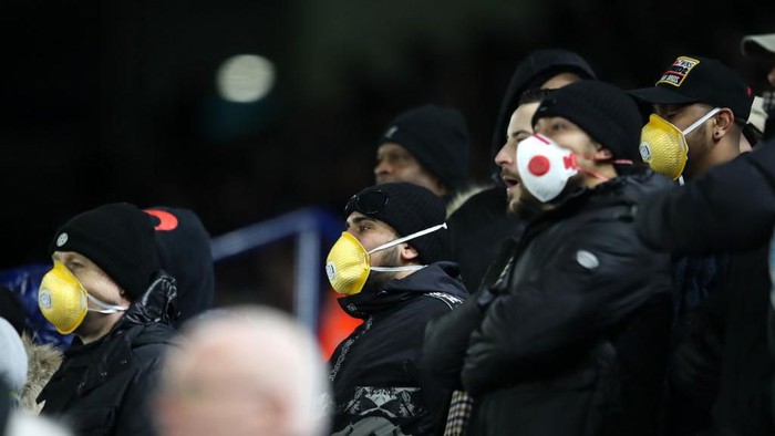 LEICESTER, ENGLAND - MARCH 04: Fans wear face masks during the FA Cup Fifth Round match between Leicester City and Birmingham City at The King Power Stadium on March 04, 2020 in Leicester, England. (Photo by Alex Pantling/Getty Images)