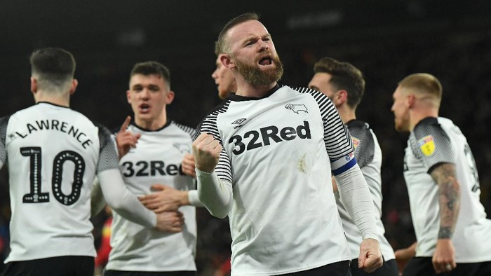 DERBY, ENGLAND - FEBRUARY 21: Wayne Rooney of Derby celebrates scoring the opening goal from a penalty during the Sky Bet Championship match between Derby County and Fulham at Pride Park Stadium on February 21, 2020 in Derby, England. (Photo by Ross Kinnaird/Getty Images)