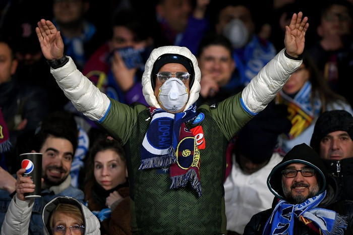 NAPLES, ITALY - FEBRUARY 25: SSC Napoli supporter with a mask due to Coronavirus before the UEFA Champions League round of 16 first leg match between SSC Napoli and FC Barcelona at Stadio San Paolo on February 25, 2020 in Naples, Italy. (Photo by Francesco Pecoraro/Getty Images)