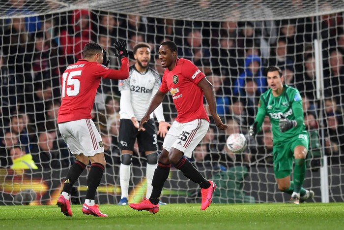 DERBY, ENGLAND - MARCH 05: Odion Ighalo of Manchester United celebrates after scoring his sides third goal with Andreas Pereira during the FA Cup Fifth Round match between Derby County and Manchester United at Pride Park on March 05, 2020 in Derby, England. (Photo by Michael Regan/Getty Images)