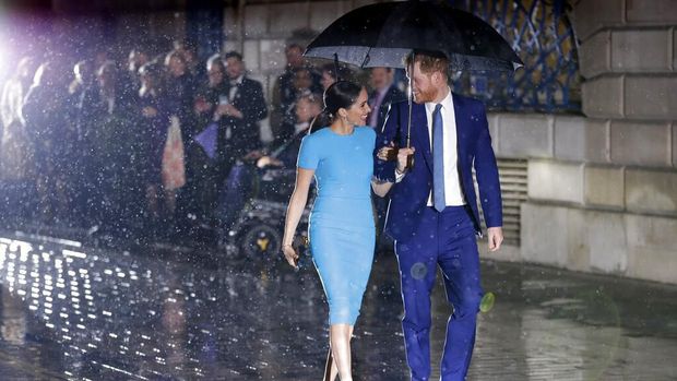Britain's Prince Harry and Meghan, the Duchess of Sussex, leave after attending the annual Endeavour Fund Awards in London, Thursday, March 5, 2020. The awards celebrate the achievements of service personnel who were injured in service and have gone on to use sport as part of their recovery and rehabilitation. (AP Photo/Kirsty Wigglesworth)