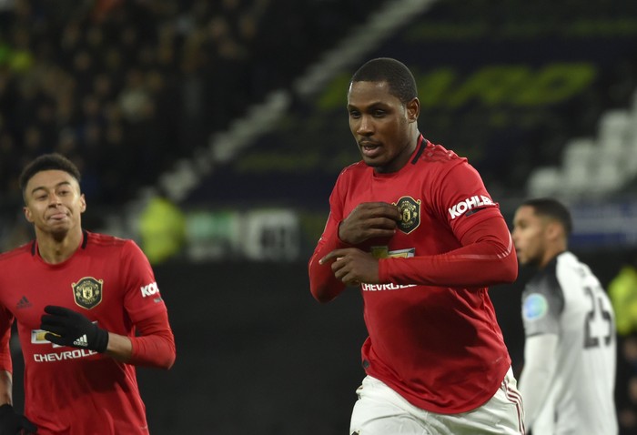 Manchester Uniteds Odion Ighalo, front right, celebrates after scoring his sides second goal during the FA Cup fifth round soccer match between Derby County and Manchester United at Pride Park in Derby, England, Thursday, March 5, 2020. (AP Photo/Rui Vieira)