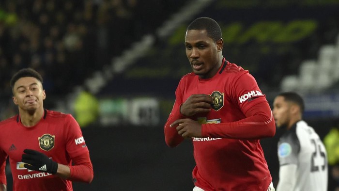 Manchester Uniteds Odion Ighalo, front right, celebrates after scoring his sides second goal during the FA Cup fifth round soccer match between Derby County and Manchester United at Pride Park in Derby, England, Thursday, March 5, 2020. (AP Photo/Rui Vieira)