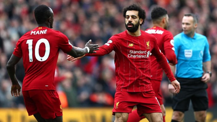 LIVERPOOL, ENGLAND - MARCH 07: Mohamed Salah of Liverpool celebrates with Sadio Mane after scoring his teams first goal during the Premier League match between Liverpool FC and AFC Bournemouth  at Anfield on March 07, 2020 in Liverpool, United Kingdom. (Photo by Jan Kruger/Getty Images)