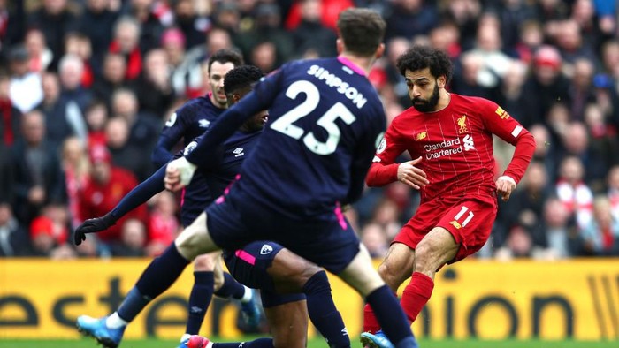LIVERPOOL, ENGLAND - MARCH 07: Mohamed Salah of Liverpool scores his teams first goal during the Premier League match between Liverpool FC and AFC Bournemouth  at Anfield on March 07, 2020 in Liverpool, United Kingdom. (Photo by Jan Kruger/Getty Images)