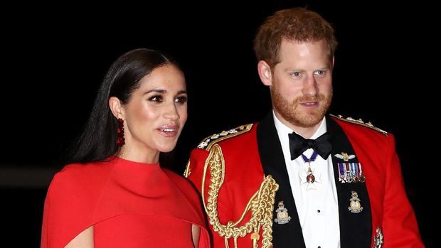 Britain's Prince Harry, Duke of Sussex and Meghan, Duchess of Sussex arrive to attend The Mountbatten Festival of Music at the Royal Albert Hall in London on March 7, 2020. - The Festival brings together world-class musicians, composers and conductors of the Massed Bands of Her Majestys Royal Marines. This year, the performance will mark the 75th anniversary of the end of the Second World War and the 80th anniversary of the formation of Britains Commandos. (Photo by SIMON DAWSON / POOL / AFP)