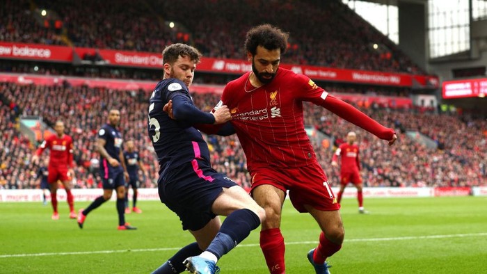 LIVERPOOL, ENGLAND - MARCH 07: Jack Simpson of AFC Bournemouth battles for possession with Mohamed Salah of Liverpool during the Premier League match between Liverpool FC and AFC Bournemouth  at Anfield on March 07, 2020 in Liverpool, United Kingdom. (Photo by Jan Kruger/Getty Images)