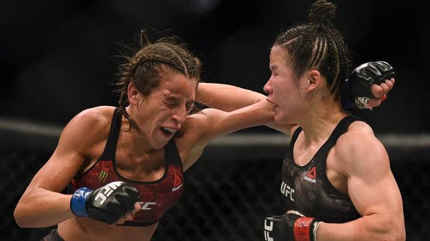 LAS VEGAS, NEVADA - MARCH 07: Weili Zhang punches Joanna Jedrzejczyk to a split decision win at T-Mobile Arena on March 07, 2020 in Las Vegas, Nevada. Harry How/Getty Images/AFP