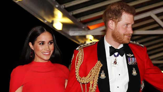 Britain's Prince Harry, Duke of Sussex and Meghan, Duchess of Sussex arrive to attend The Mountbatten Festival of Music at the Royal Albert Hall in London on March 7, 2020. - The Festival brings together world-class musicians, composers and conductors of the Massed Bands of Her Majestys Royal Marines. This year, the performance will mark the 75th anniversary of the end of the Second World War and the 80th anniversary of the formation of Britains Commandos. (Photo by SIMON DAWSON / POOL / AFP)