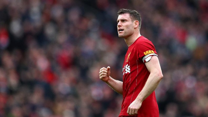 LIVERPOOL, ENGLAND - MARCH 07: James Milner of Liverpool celebrates following his sides victory in the Premier League match between Liverpool FC and AFC Bournemouth  at Anfield on March 07, 2020 in Liverpool, United Kingdom. (Photo by Jan Kruger/Getty Images)