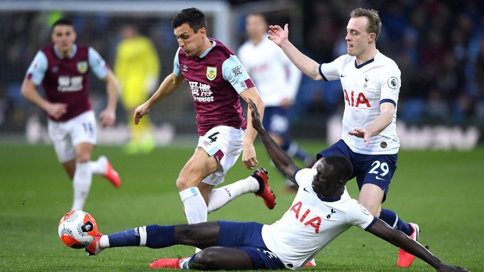 BURNLEY, ENGLAND - MARCH 07: Jack Cork of Burnley is tackled by Davinson Sanchez of Tottenham Hotspur  during the Premier League match between Burnley FC and Tottenham Hotspur at Turf Moor on March 07, 2020 in Burnley, United Kingdom. (Photo by Stu Forster/Getty Images)