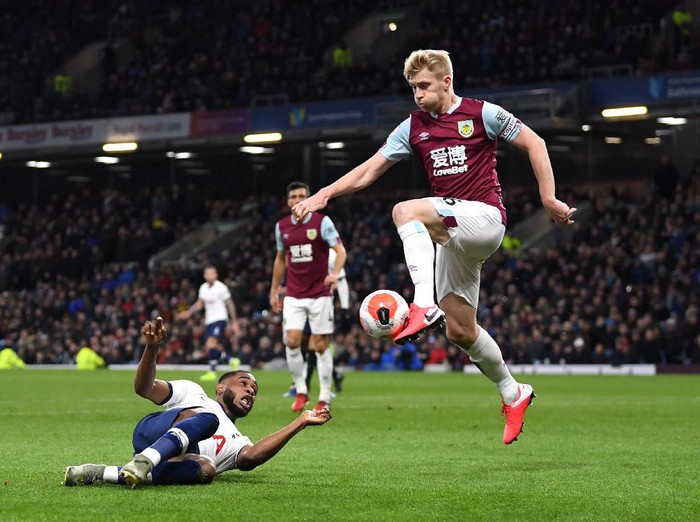 BURNLEY, ENGLAND - MARCH 07: Japhet Tanganga of Tottenham Hotspur and Ben Mee of Burnley clash during the Premier League match between Burnley FC and Tottenham Hotspur at Turf Moor on March 07, 2020 in Burnley, United Kingdom. (Photo by Michael Regan/Getty Images)