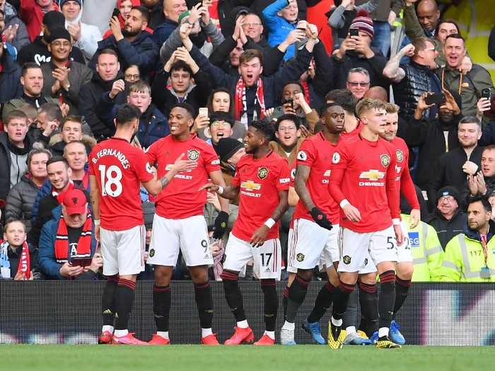 MANCHESTER, ENGLAND - MARCH 08: Anthony Martial of Manchester United celebrates with his team after scoring his sides first goal during the Premier League match between Manchester United and Manchester City at Old Trafford on March 08, 2020 in Manchester, United Kingdom. (Photo by Laurence Griffiths/Getty Images)