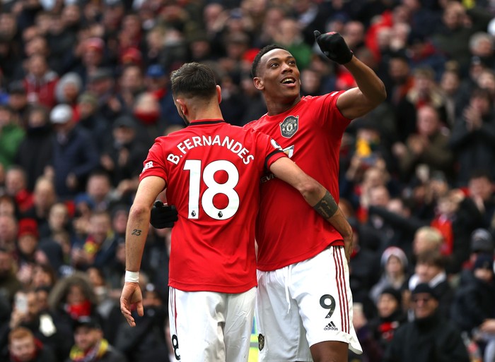 MANCHESTER, ENGLAND - FEBRUARY 23: Anthony Martial of Manchester United celebrates after scoring his teams second goal with teammate Bruno Fernandes during the Premier League match between Manchester United and Watford FC at Old Trafford on February 23, 2020 in Manchester, United Kingdom. (Photo by Clive Brunskill/Getty Images)