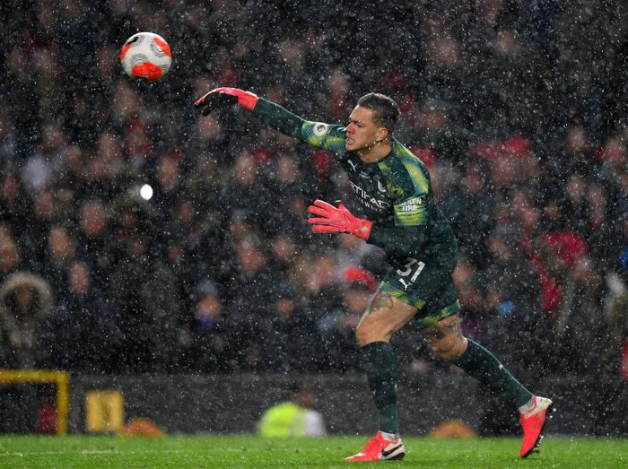MANCHESTER, ENGLAND - MARCH 08: Ederson of Manchester City clears the ball which leads to Manchester United second goal during the Premier League match between Manchester United and Manchester City at Old Trafford on March 08, 2020 in Manchester, United Kingdom. (Photo by Laurence Griffiths/Getty Images)