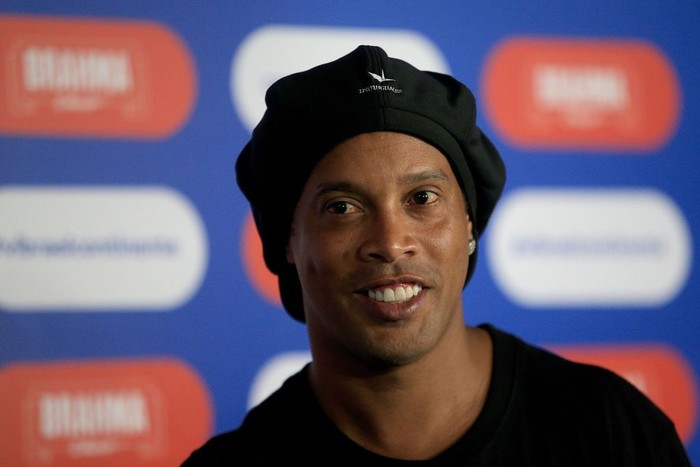 RIO DE JANEIRO, BRAZIL - JANUARY 24: Former Brazilian National Football team player Ronaldinho smiles as he arrives for the Copa America 2019 Official Draw at Cidade das Artes on January 24, 2019 in Rio de Janeiro, Brazil. (Photo by Bruna Prado / Getty Images)