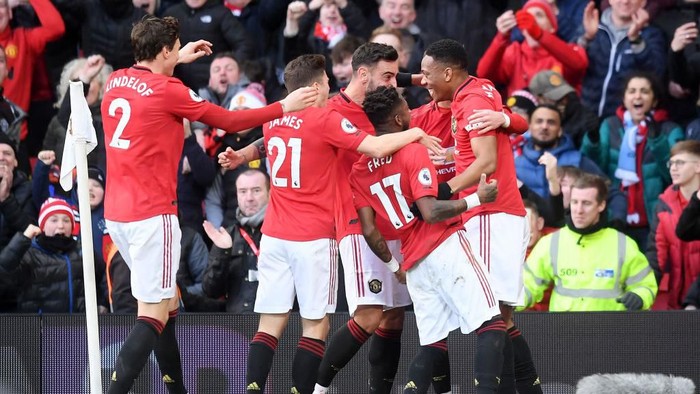MANCHESTER, ENGLAND - MARCH 08: Anthony Martial of Manchester United celebrates with his team after scoring his sides first goal during the Premier League match between Manchester United and Manchester City at Old Trafford on March 08, 2020 in Manchester, United Kingdom. (Photo by Michael Regan/Getty Images)