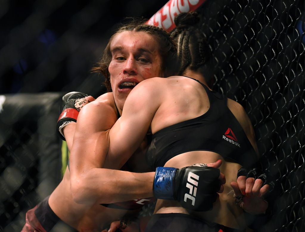 LAS VEGAS, NEVADA - MARCH 07:  Joanna Jedrzejczyk punches Weili Zhang in a split decision loss during a strawweight title bout at T-Mobile Arena on March 07, 2020 in Las Vegas, Nevada. (Photo by Harry How/Getty Images)