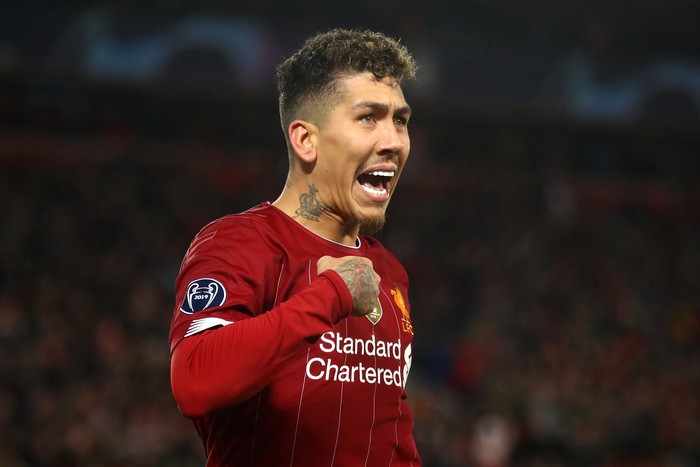 LIVERPOOL, ENGLAND - MARCH 11: Roberto Firmino of Liverpool celebrates after scoring his teams second goal during the UEFA Champions League round of 16 second leg match between Liverpool FC and Atletico Madrid at Anfield on March 11, 2020 in Liverpool, United Kingdom.  (Photo by Julian Finney/Getty Images)