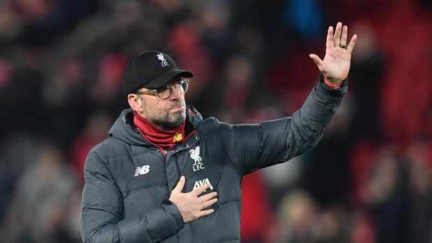 Liverpool's German manager Jurgen Klopp reacts at the final whistle during the UEFA Champions league Round of 16 second leg football match between Liverpool and Atletico Madrid at Anfield in Liverpool, north west England on March 11, 2020. (Photo by Paul ELLIS / AFP)