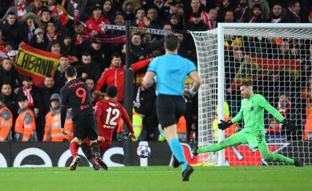 LIVERPOOL, ENGLAND - MARCH 11: Alvaro Morata of Atletico Madrid scores his team's third goal past Adrian of Liverpool during the UEFA Champions League round of 16 second leg match between Liverpool FC and Atletico Madrid at Anfield on March 11, 2020 in Liverpool, United Kingdom.  (Photo by Laurence Griffiths/Getty Images)