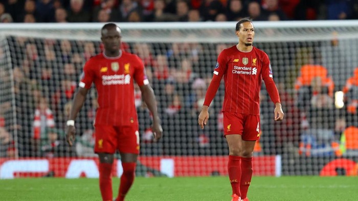 LIVERPOOL, ENGLAND - MARCH 11: Virgil van Dijk of Liverpool reacts to conceding Atletico Madrids second goal during the UEFA Champions League round of 16 second leg match between Liverpool FC and Atletico Madrid at Anfield on March 11, 2020 in Liverpool, United Kingdom.  (Photo by Julian Finney/Getty Images)