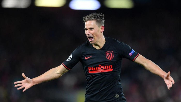 LIVERPOOL, ENGLAND - MARCH 11: Marcos Llorente of Atletico Madrid celebrates after scoring his teams second goal during the UEFA Champions League round of 16 second leg match between Liverpool FC and Atletico Madrid at Anfield on March 11, 2020 in Liverpool, United Kingdom.  (Photo by Laurence Griffiths/Getty Images)